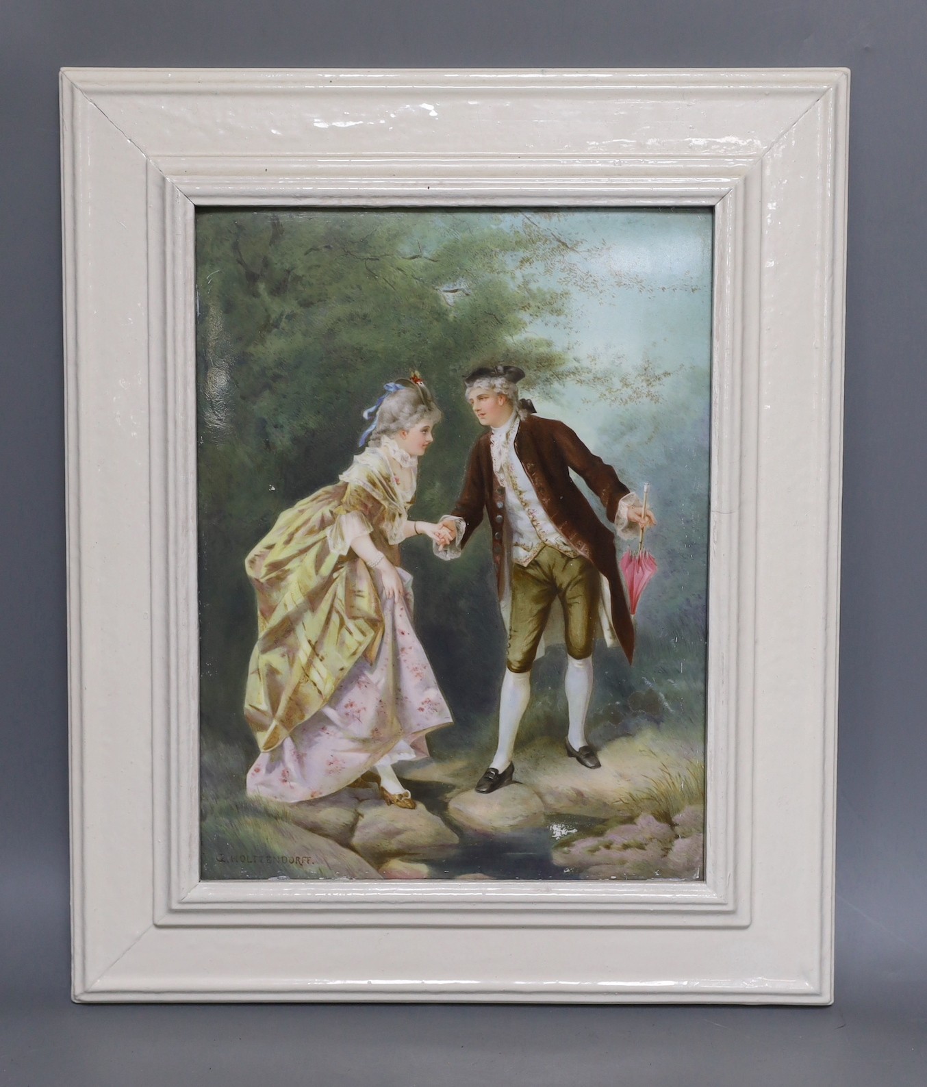 A Continental porcelain plaque depicting Otto Eduard Erdmann’s courting scene ‘The Romantic Stroll’, in white frame. 26 x 19cm